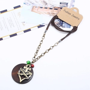 Vintage long wax cord necklace with alloy heart and cross pendant on a display card