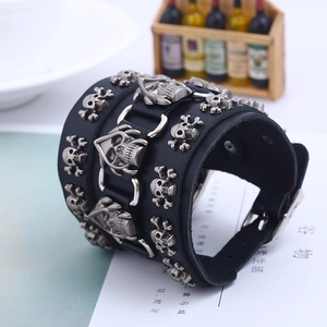 Punk wide black leather bracelet featuring vintage skull and crossbones metal studs
