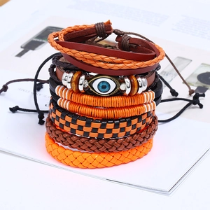 Retro multi-layer leather bracelet set with orange woven ropes and blue evil eye charm