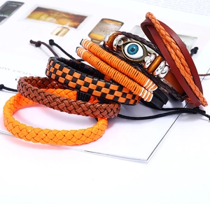 Retro multi-layer woven leather bracelet set with orange accents and blue evil eye bead