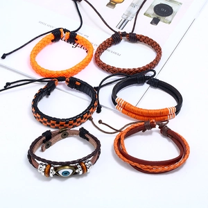 6-piece set of vintage woven leather bracelets with charms in orange and brown tones