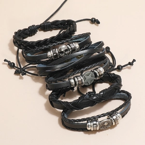Vintage braided leather bracelet set for men featuring skull and star alloy charms
