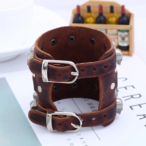 Retro punk wide brown leather bracelet with silver skull metal accents and buckle