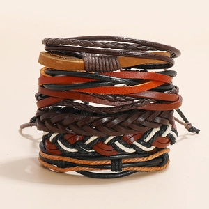 Detailed view of multilayer braided leather bracelet stack with wax cord and boho texture