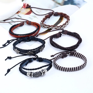Retro multi-layer men's leather bracelet set with woven straps and sun totem charms