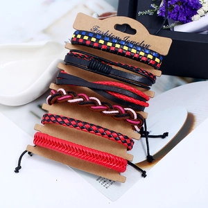 Detailed view of a 6-piece woven leather bracelet set on a vintage brown card