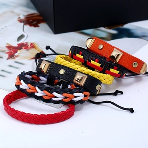 Retro woven leather bracelet set with metallic pyramid studs and adjustable drawstrings