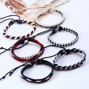 Detailed view of six adjustable braided leather bracelets in various punk retro patterns