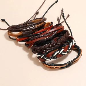 Vintage braided leather bracelet set featuring multiple brown and black layered wristbands