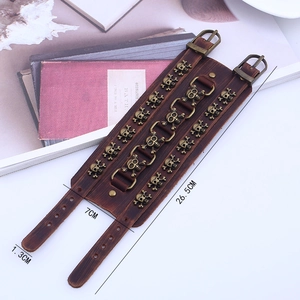 Retro brown leather cuff bracelet with bronze skull studs and buckle closure