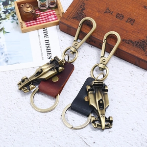 Vintage bronze racing car keychains with genuine leather straps in a two-piece gift set