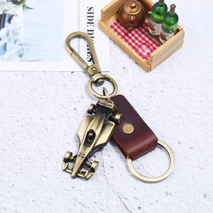 Vintage alloy racing car keychain with genuine leather strap and bronze finish metal rings
