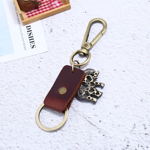 Vintage leather elephant keychain with bronze alloy hook and heart patterns