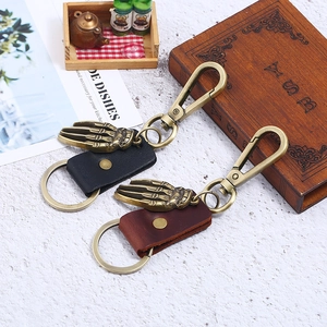 Vintage leather keychain with metal skeleton hand pendant and heavy lobster clasp
