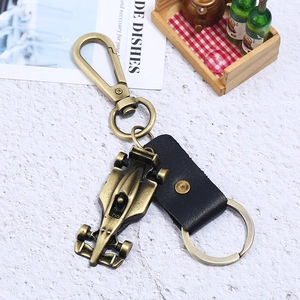 Vintage F1 racing car alloy keychain with black leather strap and bronze finish