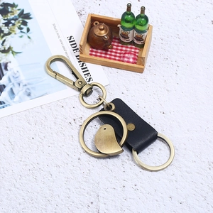 Vintage bronze alloy bird pendant keychain with genuine black leather and spring carabiner