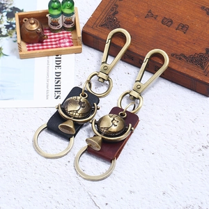 Vintage globe keychains with leather handles in black and brown finishes