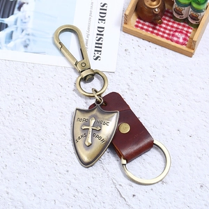 Retro genuine leather keychain with bronze shield pendant and metal carabiner clasp