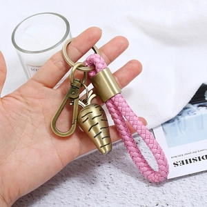 Pink braided leather keychain with bronze carrot pendant and heavy-duty metal carabiner