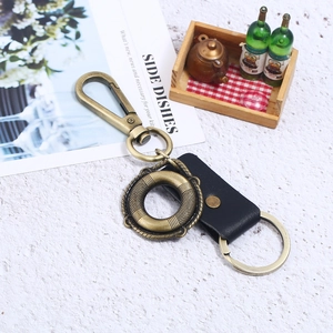 Vintage bronze alloy keychain with black leather strap and heavy-duty swivel hook