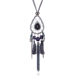Detailed view of bohemian long necklace featuring dreamcatcher design and purple stone charms