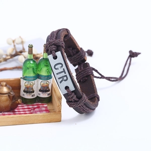 Retro brown woven leather bracelet for men featuring a CTR engraved metal plaque and rope detail
