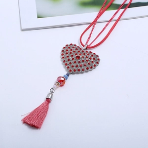 Fashion red heart tassel long necklace with rhinestones for women on white backdrop