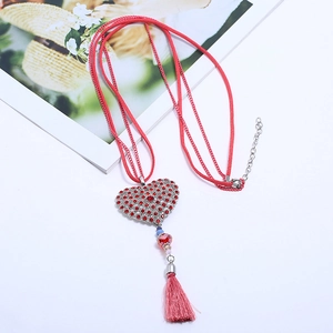 Fashion alloy red heart rhinestone tassel necklace on a white background