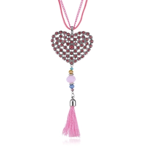 Close-up of heart-shaped pendant with pink rhinestones and colorful beaded tassels