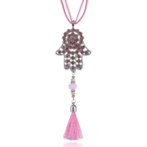 Detailed shot of Hamsa hand pendant with pink rhinestones and silk tassel fringe