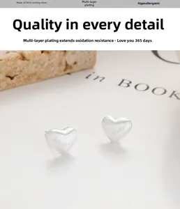 Detailed view of S925 sterling silver heart earrings with a brushed matte finish surface