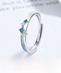 Macro shot of S925 sterling silver ring showing blue enamel stars and inset cubic zirconia
