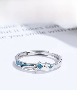 Detail of S925 sterling silver adjustable ring with star blue enamel and zircon inlay