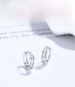 Detail view of S925 sterling silver hoop earrings with a dual-line hollow woven structure