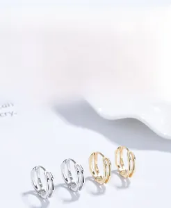 Macro detail of S925 sterling silver bamboo hoop earrings with visible S925 hallmark stamps