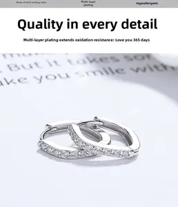 Detail of S925 silver square hoop earrings with sparkling cubic zirconia inlay
