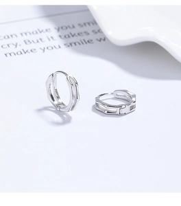 Detail of S925 sterling silver hoop earrings with double-layered hexagonal hollow design