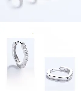 Detailed macro view of S925 sterling silver hoop earrings with white zircon stones