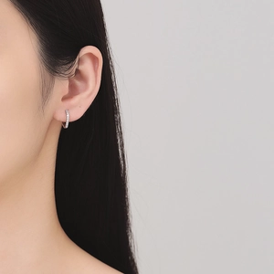 Elegant S925 sterling silver geometric square zircon huggie hoop earrings on model
