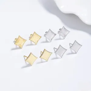 Detailed macro view of S925 silver rhombic stud earrings with vintage hammered textures
