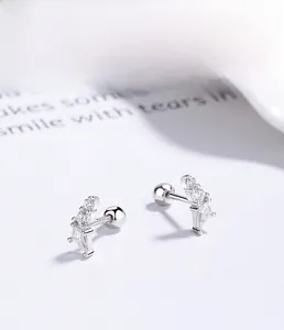 Detailed macro view of S925 sterling silver geometric stud earrings with cubic zirconia