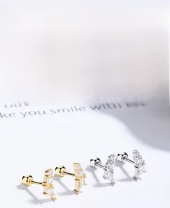 Macro detail of S925 sterling silver geometric zircon stud earrings with screw backs