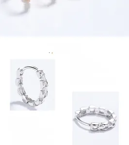 Detailed view of S925 sterling silver hoop earrings with textured geometric patterns