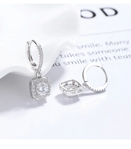 Macro detail of S925 silver halo square drop earrings with sparkling cubic zirconia