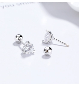 Macro view of S925 silver stud earrings with six-prong zircon and screw ball back