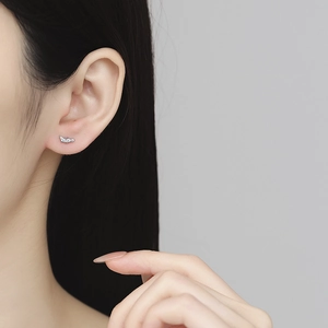 S925 sterling silver geometric zircon stud earrings with screw back on model's ear