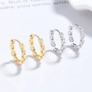 S925 sterling silver geometric chain hoop earrings in gold and silver set on white background