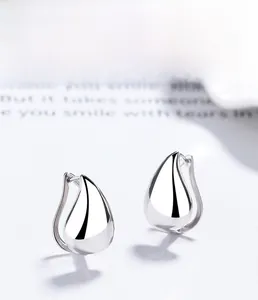 Detailed view of polished 925 sterling silver teardrop earrings with multi-layer plating
