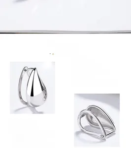 Detailed macro view of S925 sterling silver teardrop earrings with a high-polished finish