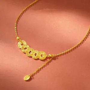 Macro detail of 925 silver gold-plated ring with five Chinese coin charms and extender chain